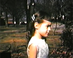 8mm_01_031_Susan in dress on Carrollton - squirrel